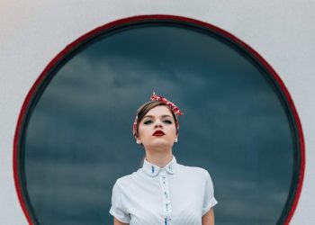 woman wearing white shirt and white skirt