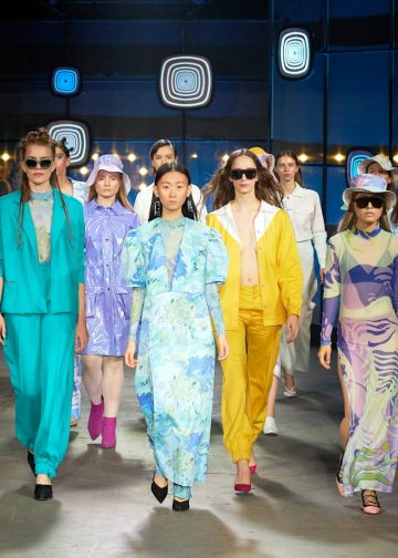 group of women in blue and pink traditional dresses
