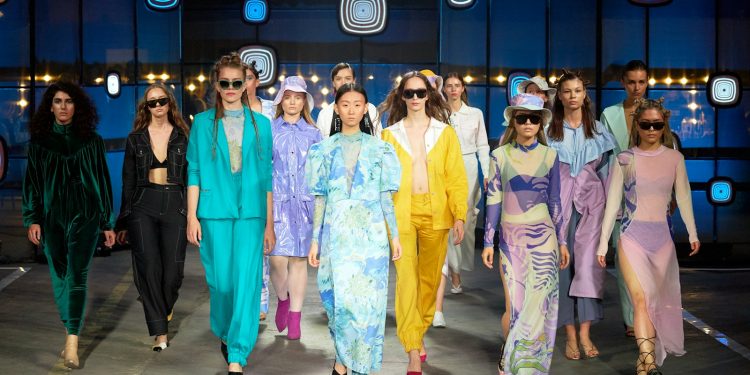 group of women in blue and pink traditional dresses