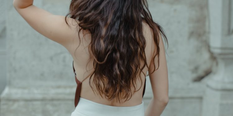 woman in white tank top and white skirt