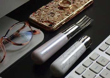 silver and black tube type vape beside brown leather pouch