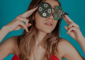 woman covering her eyes with circuit boards