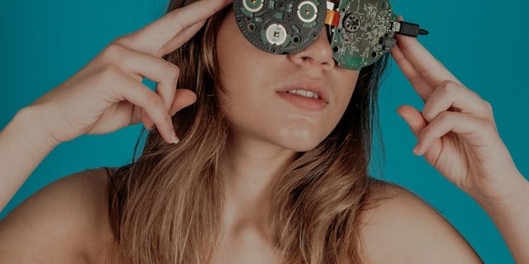 woman covering her eyes with circuit boards