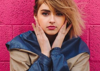 woman in blue and brown jacket